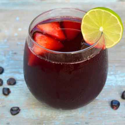 Chicha Morada - A refreshing sweet-tart Peruvian drink. It gets its gorgeous hue from dried purple corn. Blended pineapple and apple and spiced with cinnamon and cloves, this sangria-like mocktail is the perfect summer drink.